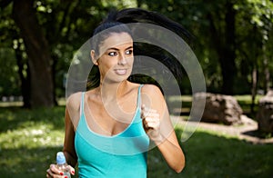 Young woman training in citypark