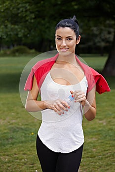 Young woman training in citypark smiling photo