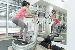 Young woman training in the gym photo