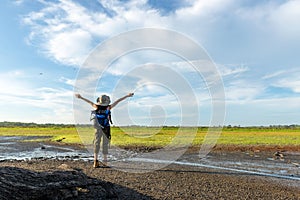 Young woman travel and explore adventure raise hands