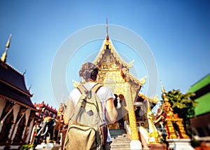 A young woman travel to Thailand, visiting the sights. Buddhist