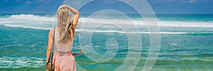 Young woman traveler on amazing Melasti Beach with turquoise water, Bali Island Indonesia BANNER, LONG FORMAT