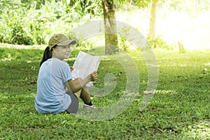 Young Woman Traveler with backpack relaxing outdoor with waterfa