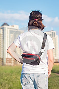 Young woman traveler in the fields