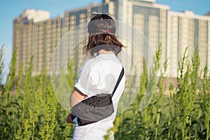 Young woman traveler in the fields