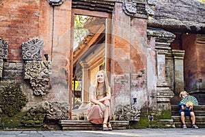 Young woman traveler in Ubud palace, Bali - Inside the Ubud palace, Bali, Indonesia