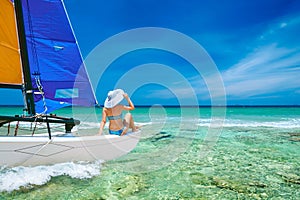 Young woman traveling by boat among the islands.