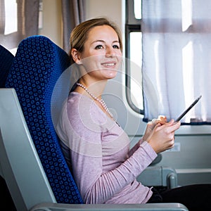 Young woman traveling by train