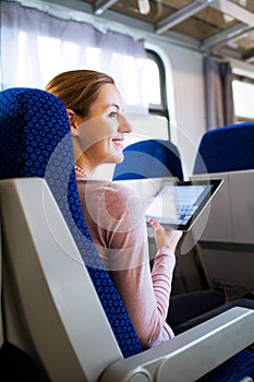 Young woman traveling by train