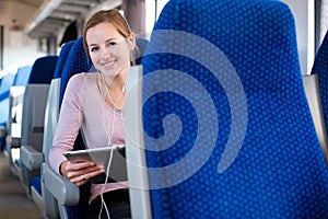 Young woman traveling by train