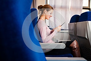 Young woman traveling by train