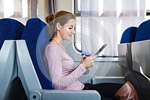 Young woman traveling by train