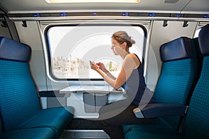 Young woman traveling by train