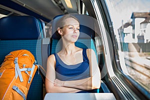 Young woman traveling by train