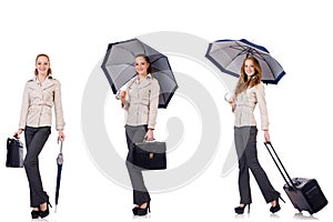 Young woman travelling with suitcase and umbrella isolated on wh