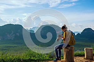 Young woman travels to take pictures of nature on the mountain. Travel adventure. Landscape Beautiful Mountain on sea at Samet