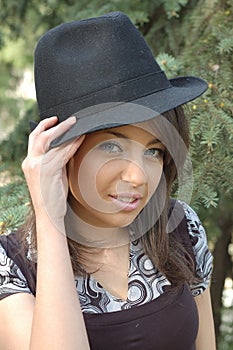 Young woman in trendy hat