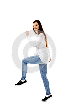 Young woman trying to trample something