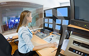Young woman TV director at editor