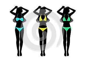 Young woman in two-pieces swimsuit taking sunbath silhouettes se