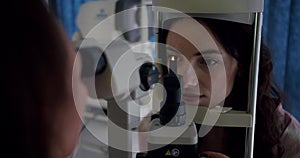 Young Woman Undergoing Eye Examination at Ophthalmologist