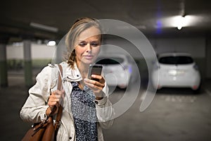 Young woman in an underground parking