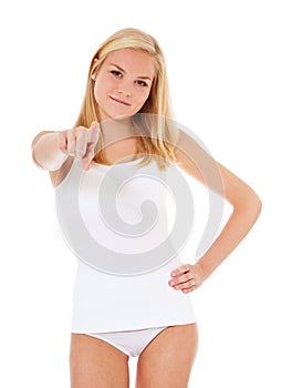 Young woman in underwear pointing with finger