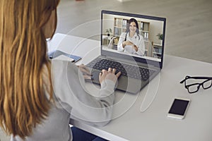 Young woman uses online doctor service staying at home. Telemedicine concept.