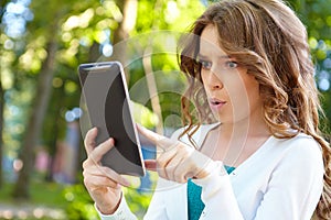 Young woman uses tablet pc.