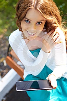 Young woman uses tablet pc.