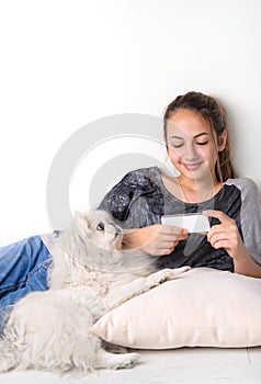 Young woman using app on mobile smart phone .