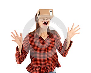 Young woman using cardboard virtual reality headset