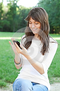 Young woman using cell phone