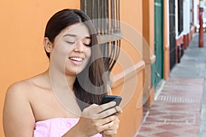 Young woman using cellphone outdoors