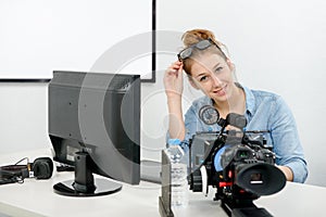 Young woman using computer for video editing