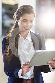 Young woman using digital tablet