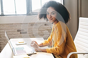 Young woman is using handfree headset