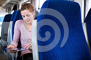 Young woman using her tablet computer