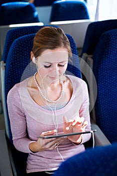 Young woman using her tablet computer