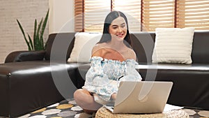 Young woman using laptop with for online shopping E commerce. Blithe