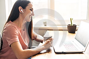 A young woman using laptop for video call, zoom