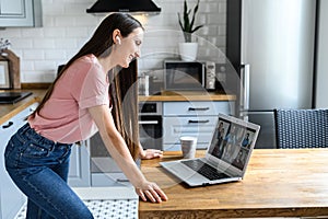 A young woman using laptop for video call, zoom