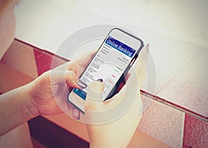 Young woman using mobile banking with smartphone.
