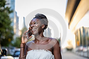 Young woman using mobile phone in the city