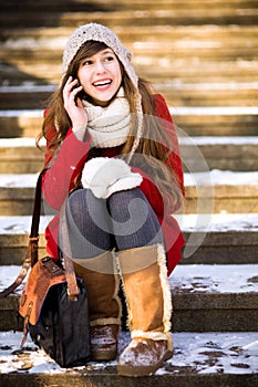 Young woman using mobile phone outdoors