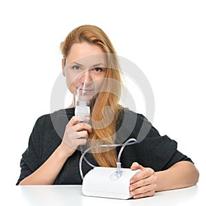 Young woman using nebulizer mask for respiratory inhaler Asthma