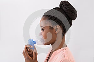 Young Woman Using Oxygen Mask