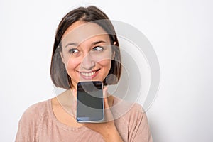 Young woman using phone vocal assistant isolated on white background