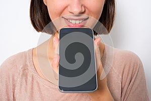 Young woman using phone vocal assistant and sending vocal message