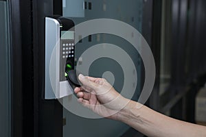 Young woman using RFID tag key to open the door